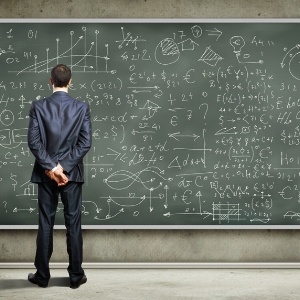 Business person standing against the blackboard with a lot of data written on it-159308-edited.jpeg
