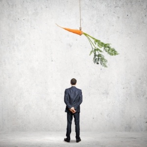 Funny image of businessman chased with carrot-470449-edited.jpeg